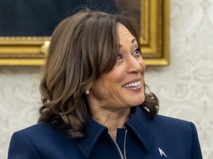 President Joe Biden talks with Vice President Kamala Harris before a meeting with Congress