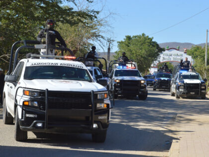 Members of the Mexican National Guard stand guard at the main entrance of Jesus Maria, Mex