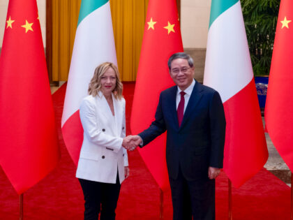 Italy's Prime Minister Giorgia Meloni shakes hands with Chinese Premier Li Qiang in Beijin