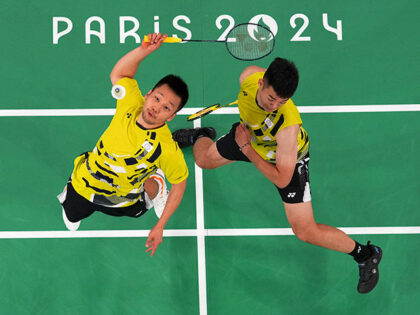 Taiwan's Wang Chi-Lin, left, and Lee Yang play against China's Liang Weikeng and Wang Chan