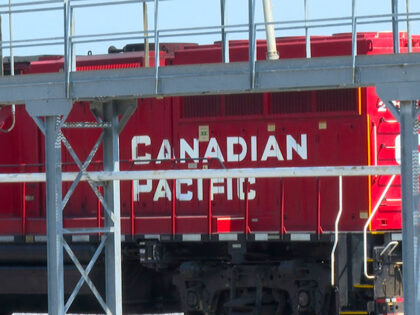 A Canada Pacific (CPKC) train stopped in a railyard near the CPKC offices located in Kansa