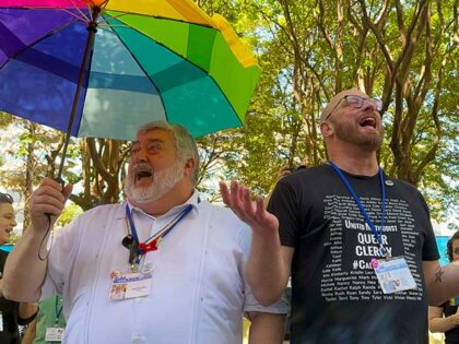 The Rev. David Meredith, left, and the Rev. Austin Adkinson sing during a gathering of tho