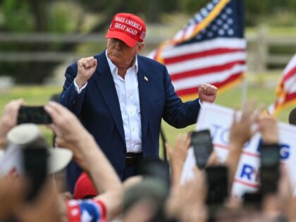 Former US President and Republican presidential candidate Donald Trump arrives onstage to