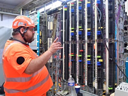 An employee checks the telephone connections of the various machines running on the networ