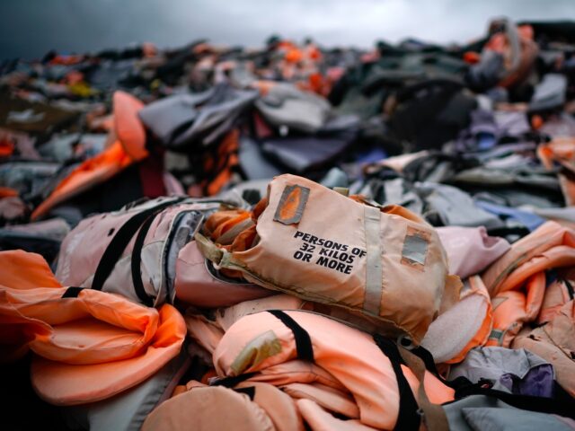 SKALA SIKAMINEAS, GREECE - OCTOBER 08: Thousands of Life jackets and rubber boats, abandon