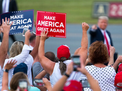 President Donald Trump greets fans at a campaign rally at Smith Reynolds Airport on Septem