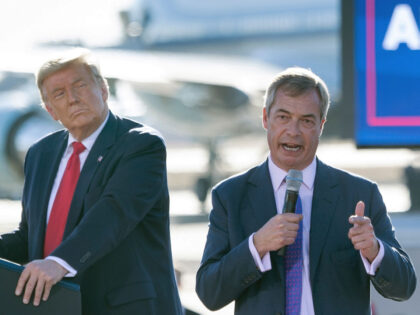 US President Donald Trump listens as Nigel Farage (R) speaks during a Make America Great A