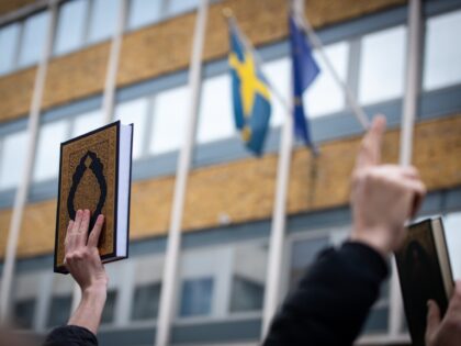 LONDON, UNITED KINGDOM - 2023/01/28: Protestors raise the Quran during the demonstration a