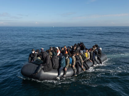 ENGLISH CHANNEL - MARCH 06: An inflatable dinghy carrying around 65 migrants crosses the E