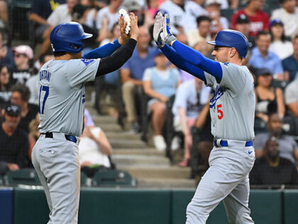 Freddie Freeman #5 of the Los Angeles Dodgers is congratulated by Shohei Ohtani #17 of the