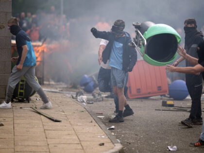 ROTHERHAM, ENGLAND - AUGUST 4: Riot police clash with anti-migration protesters outside of