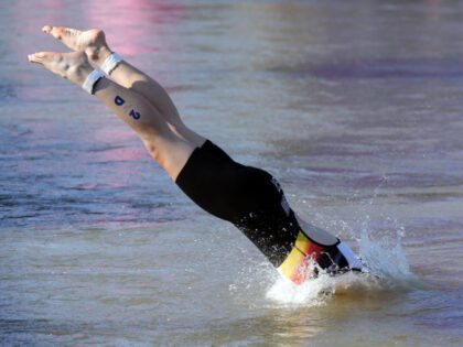 TOPSHOT - Germany's Laura Lindemann jumps into the water to compete in the swimming r