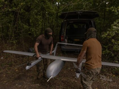 Ukrainian military drone operators of the 22nd Mechanized Brigade carry a Poseidon reconna