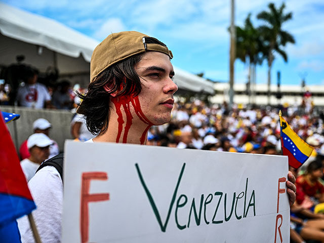 A demonstrator holds a sign as they take part in the "Protest for Truth" rally called by t