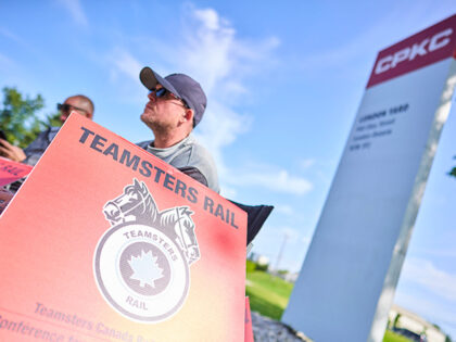 Canadian Pacific Kansas City (CPKC) rail workers stand on the picket line at the company's