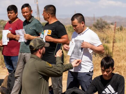 SAN DIEGO, CA - JUNE 13: Migrants are processed by the U.S. Border Patrol near the Jacumba