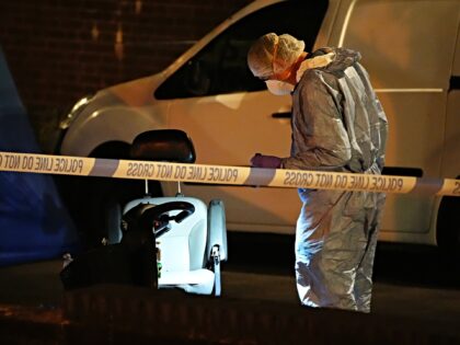 A forensic officer on Overbury Street near the scene in Rushmore Road, Clapton, east Londo