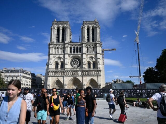 Tourists at Notre Dame de Paris, in Paris, on August 8, 2024. (Photo by Magali Cohen / Han