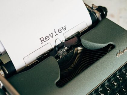 typewriter writing a review